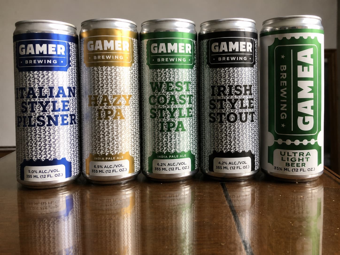 Assorted Gamer Brewing beer cans